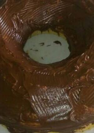 Una foto de Torta esponjosa con dulce de leche y chocolate cobertura