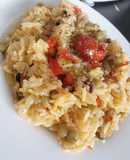 Arroz con mix de mariscos toque de curry y vino blanco
