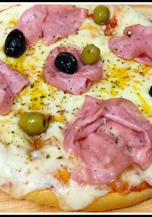 A picture of Pizza with Italian Mortadella.