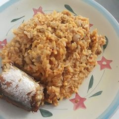 A picture of Rice and beans porriage with fish.
