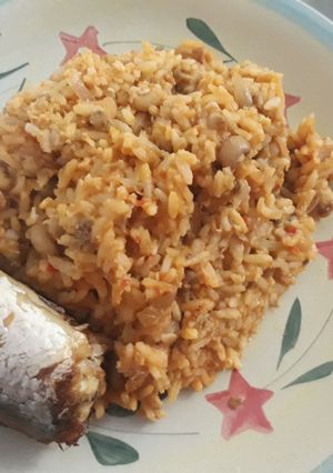 A picture of Rice and beans porriage with fish.