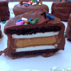 A picture of Chocolate dipped peanut butter stuffed oreos.