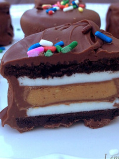 A picture of Chocolate dipped peanut butter stuffed oreos.