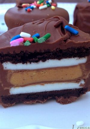 A picture of Chocolate dipped peanut butter stuffed oreos.