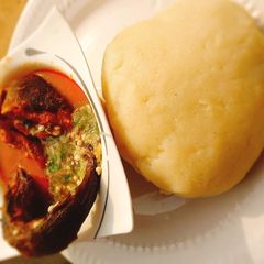A picture of Okro and stew with garri.