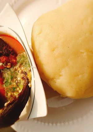 A picture of Okro and stew with garri.