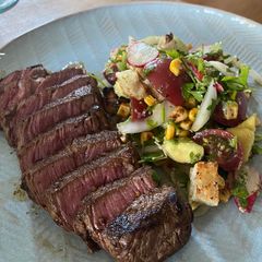 A picture of Cowboy Steak with Charred Corn Panzanella.