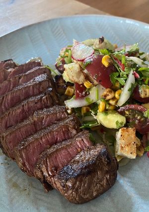A picture of Cowboy Steak with Charred Corn Panzanella.