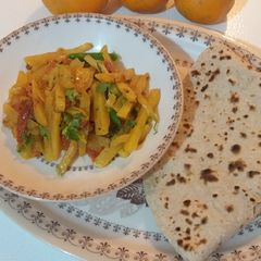 A picture of Aloo ki bhujya with roti.