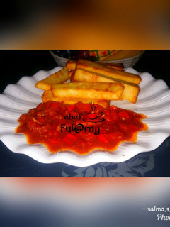 A picture of Fried yam with garlic and tomatoes souce by salma.s.Adam.