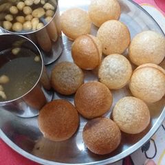 A picture of Golgappe with water.
