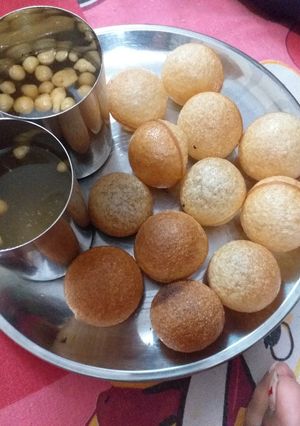 A picture of Golgappe with water.
