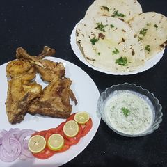 Chicken tikka with homemade tawa naan A picture of Chicken tikka with homemade tawa naan.