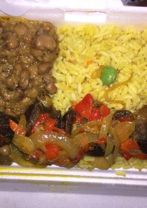 A picture of Fried rice and beans with beef kebab.