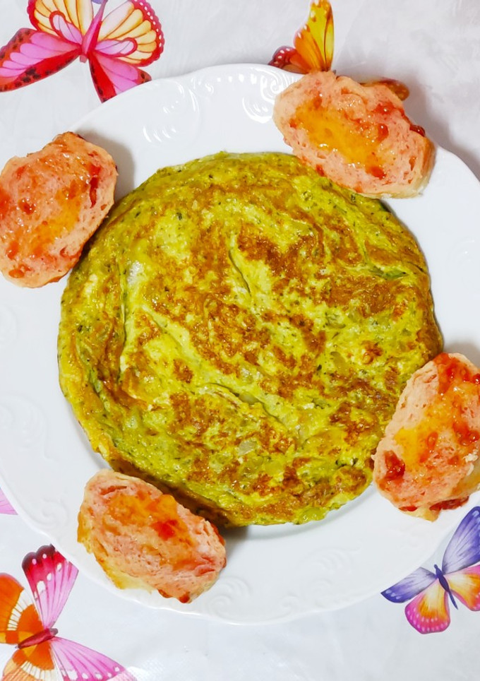 Una foto de Tortilla de cebolla y perejil