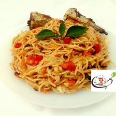 Fried fish with creamy pasta in vegetable sauce A picture of Fried fish with creamy pasta in vegetable sauce.