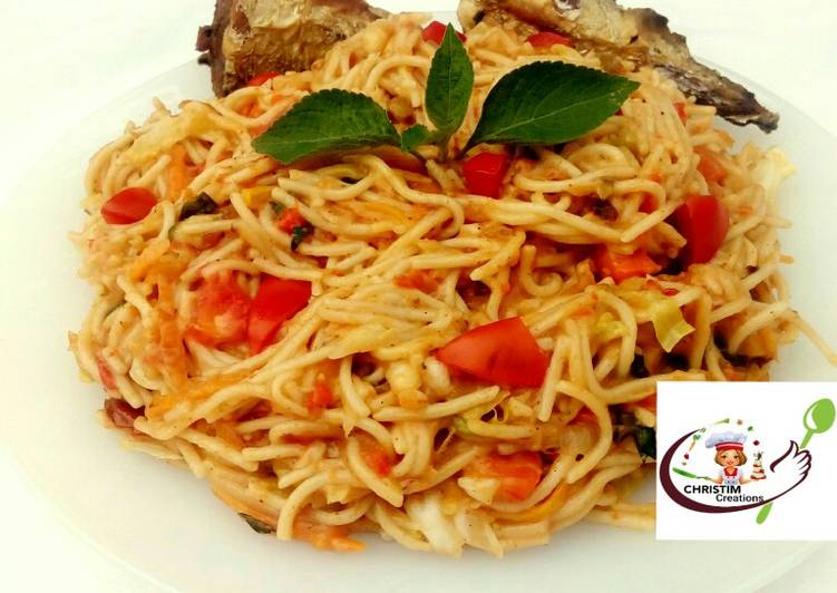 Fried fish with creamy pasta in vegetable sauce