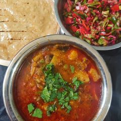 A picture of Ringan Bataka Vatana nu shak (brinjal potato and peas sabzi).