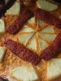 Pizza con chorizo y piña