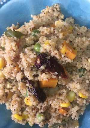 A picture of Broken wheat or Daliya with vegetables.