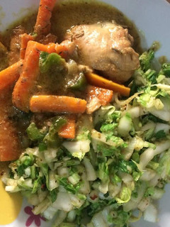 A picture of Cabbage with carrots and boiled chicken.