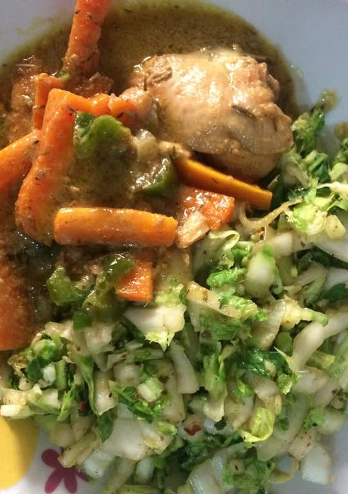 A picture of Cabbage with carrots and boiled chicken.