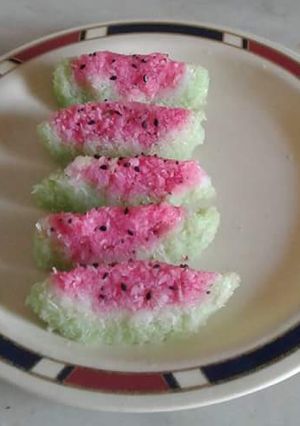 A picture of Water melon shaped coconut Burfi.