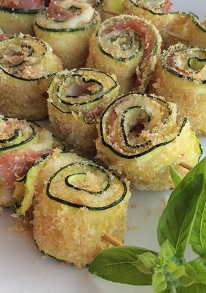 A picture of Zucchini Rolls with Speck and Scamorza Cheese.