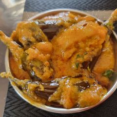 A picture of Stuffed Brinjal potatoes in gravy.