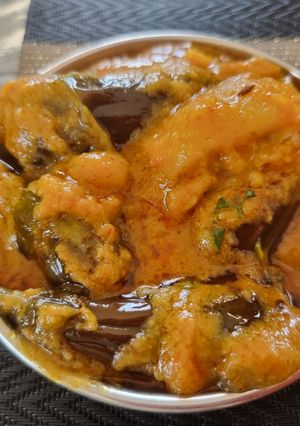 A picture of Stuffed Brinjal potatoes in gravy.