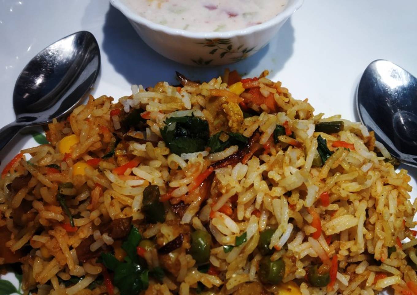 Vegetable Dum Biryani with Onion,Tomato and cucumber Raita