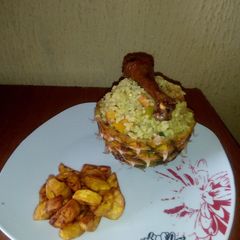A picture of Pineapple Fried rice with fried Chicken and Diced Dodo.