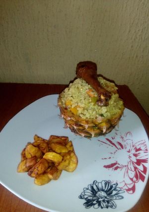 A picture of Pineapple Fried rice with fried Chicken and Diced Dodo.