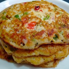 A picture of SPICY PUFFED RICE PANCAKES using Egg and Vegetables - EASY BREAKFAST RECIPE.