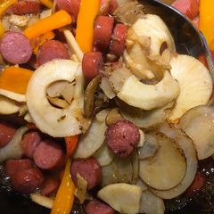 A picture of Kielbasa and potatoes.