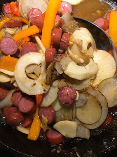 A picture of Kielbasa and potatoes.