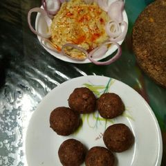 A picture of Falafel with hummus dip.