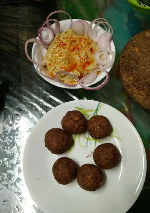 A picture of Falafel with hummus dip.
