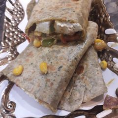 A picture of Indian style burrito.