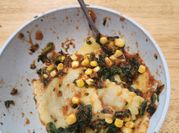 A picture of leafy greens and corn