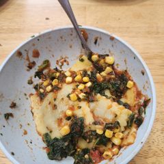 A picture of Ravioli with Corn and Spinach.