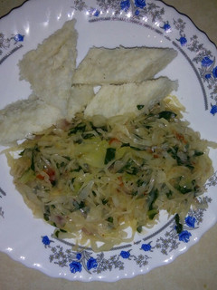 A picture of Ugali cabbage and spinach.