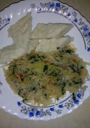 A picture of Ugali cabbage and spinach.