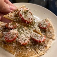 Emergency hors d’oeuvre - chapati with duck rillettes and tomato A picture of Emergency hors d’oeuvre - chapati with duck rillettes and tomato.