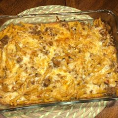 A picture of Penne pasta with ground beef.