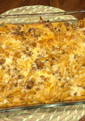 A picture of Penne pasta with ground beef.
