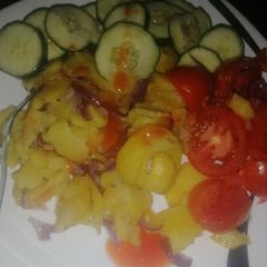 A picture of Sauteed potatoes with onions.