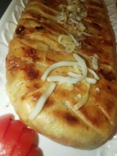 صورة لوصفة بيتزا بشكل جديد مثل الضفيرة