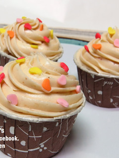 A picture of Vanilla Muffins with Strawberry Cream Cheese Sauce.