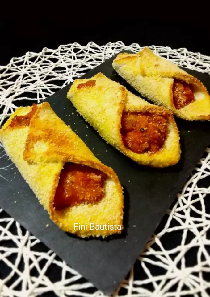 Una foto de Pestiños salados de pan de molde con bacon y queso